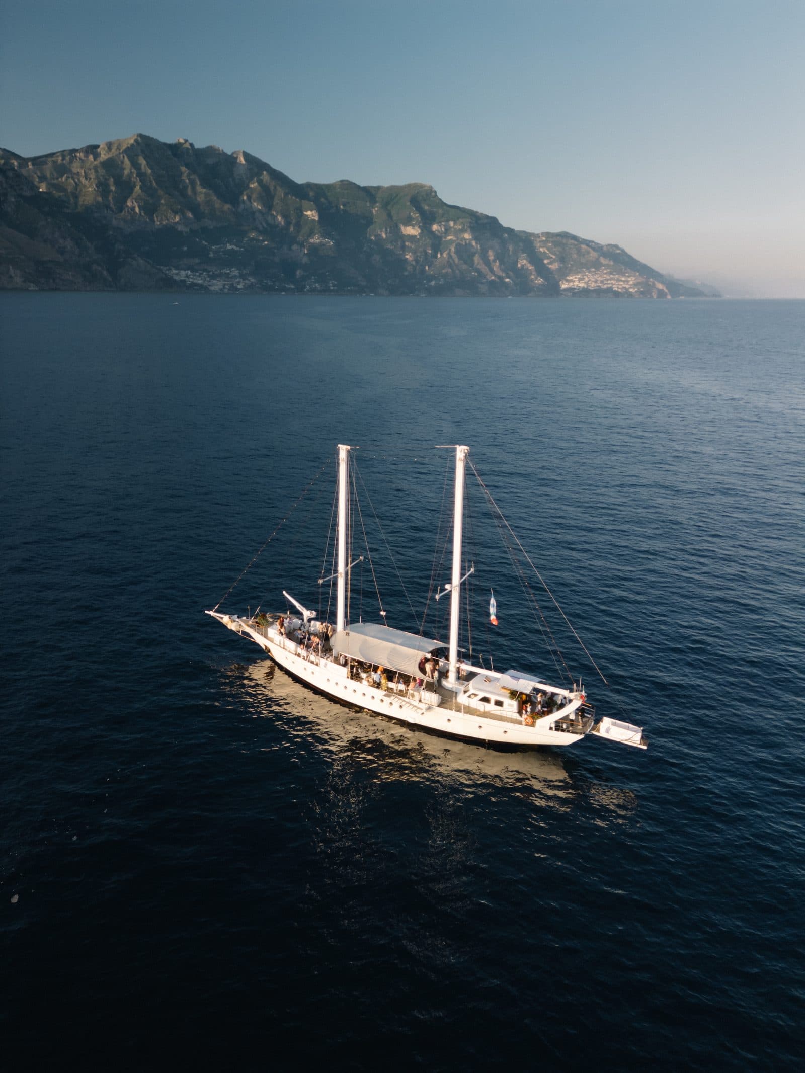 Sailing boat leaving the Sorrento coast towards Capri